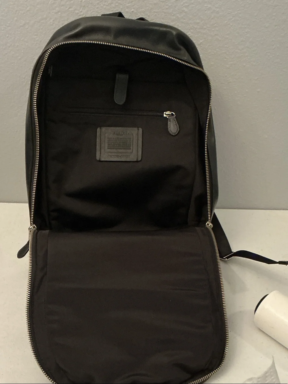 Coach Black Leather Sling Backpack with Front Pocket